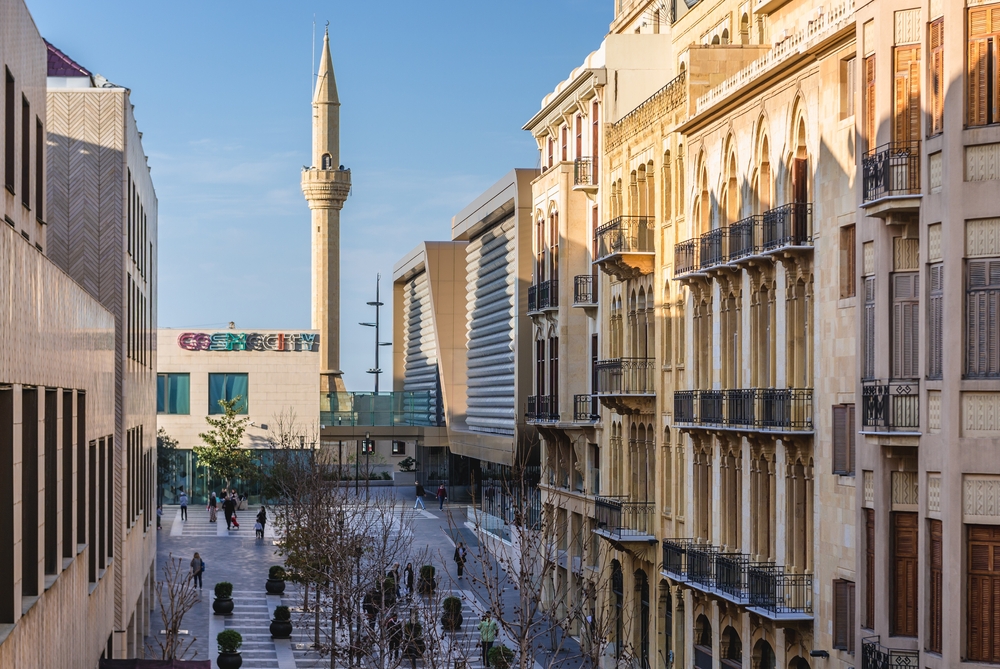 An almost-empty street as part of Beirut Souks shopping mall with Al Majidiyyeh mosque minaret in the background
