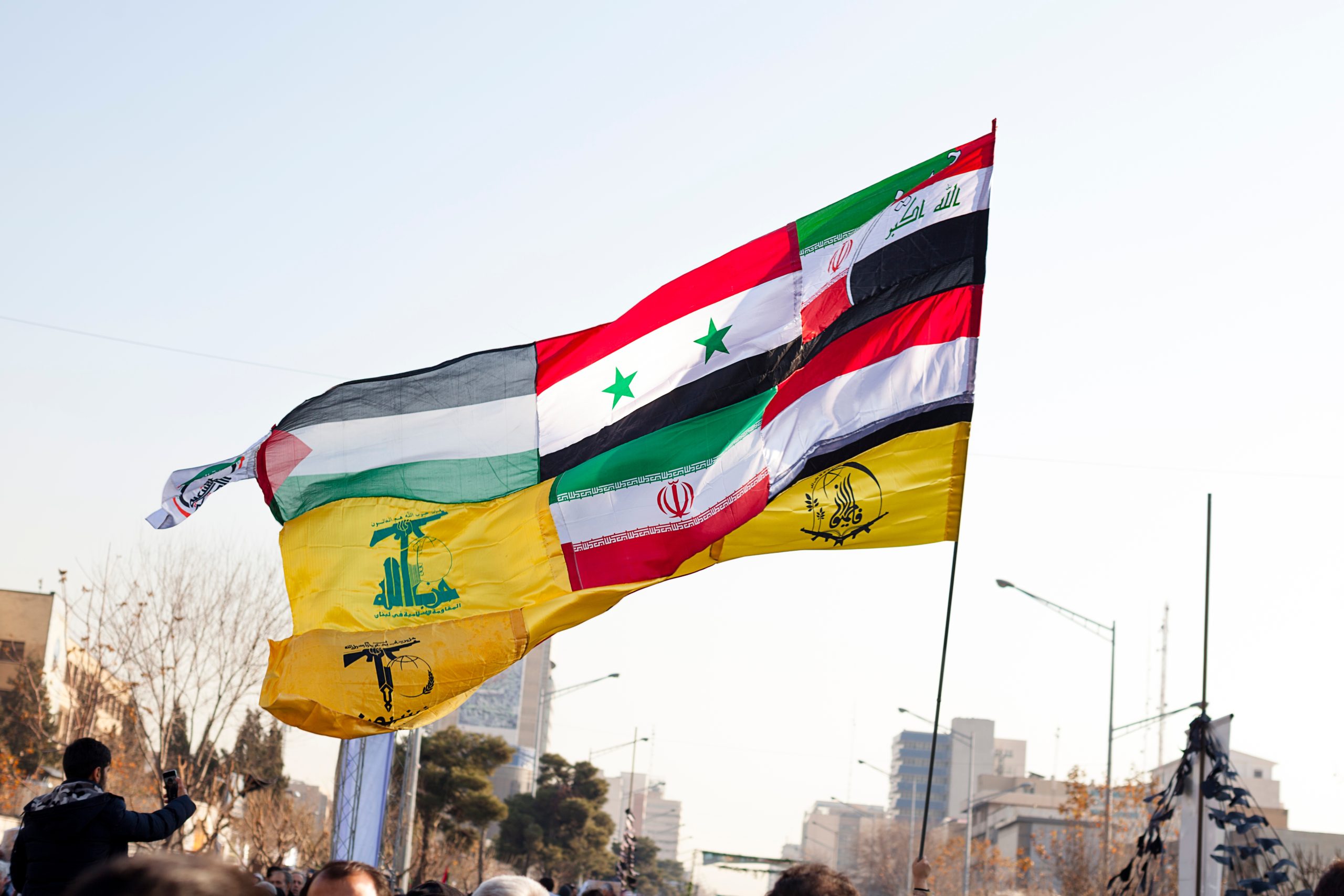 A flag made up of the flags of the resistance groups allied with Iran